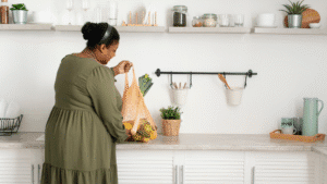 woman with grocery bag in kitchen
