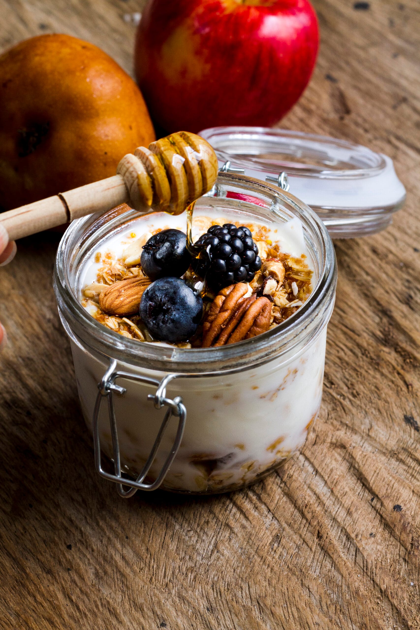 high angle overnight oats with black forest fruits nuts honey